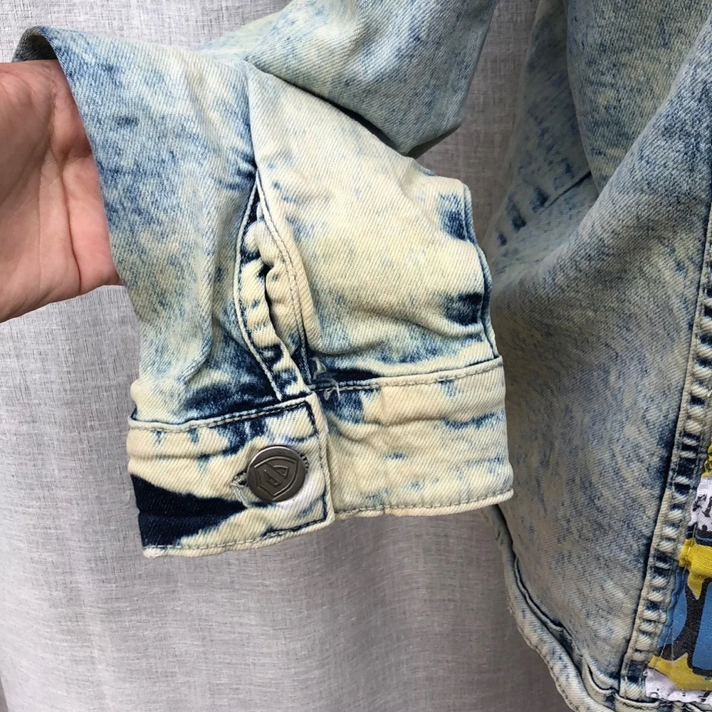 Encrypted comic book pop art  appliqué back distressed acid wash denim jacket
